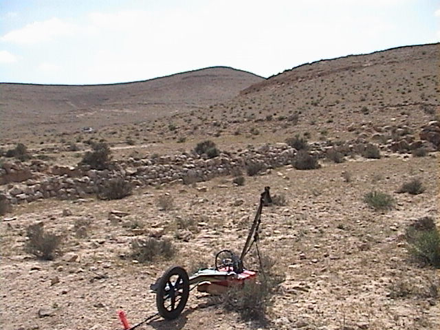 Jessie executing a rough terrain GPR survey at Avdat ancient archaeological terraces - click for GPR Field Study Slide Show