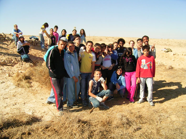 Nitzana farm maintenance project with students includes overturning of the soil, getting rid of bushes and brush, cleaning up the area, and planting.  These kids at Nitzana High School are having fun, while taking care of their historic environment.