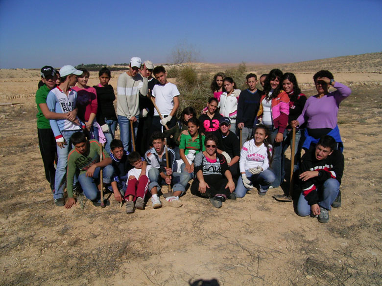 Nitzana farm maintenance project with students includes overturning of the soil, getting rid of bushes and brush, cleaning up the area, and planting.  These kids at Nitzana High School are having fun, while taking care of their historic environment.