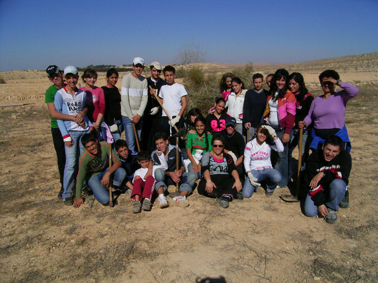 Nitzana farm maintenance project with students includes overturning of the soil, getting rid of bushes and brush, cleaning up the area, and planting.  These kids at Nitzana High School are having fun, while taking care of their historic environment.