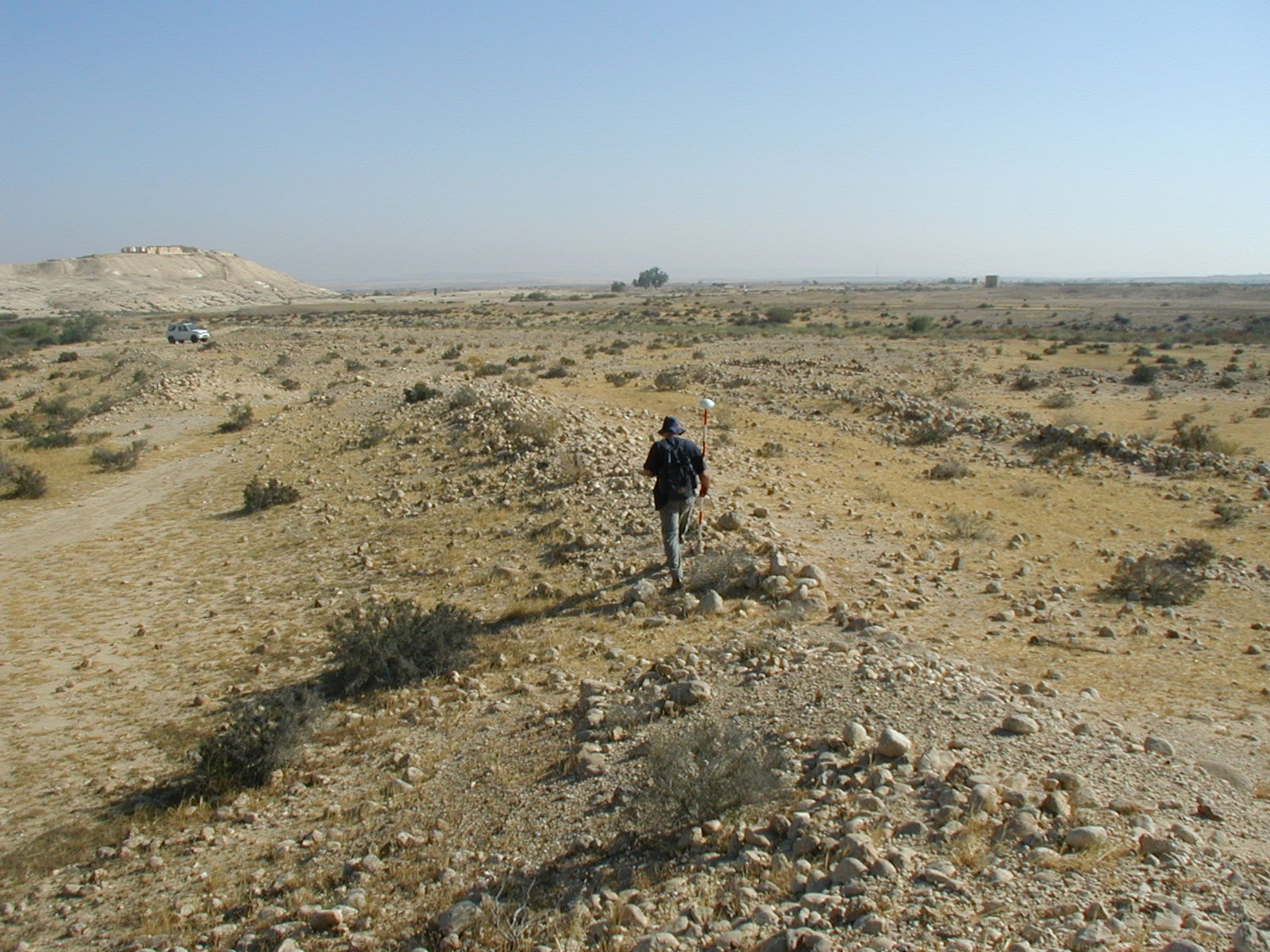 Nitzana Archaeological Survey: Mapping the agricultural systems with G.P.S. The white hill at the upper left is the ancient town of Nitzana.