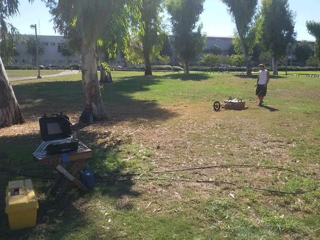 Ground penetrating radar survey at Groningen park, Yaffo. (Photo taken by Jessie Pincus)